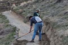Raking gravel onto Canyon Trail